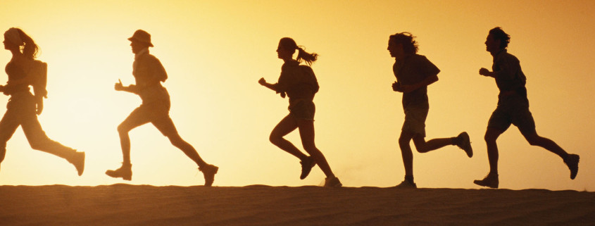 A Group Running Silhouette in the Sun