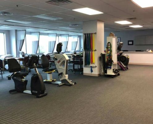 A Physical Therapy Gym With a Carpeted Floor
